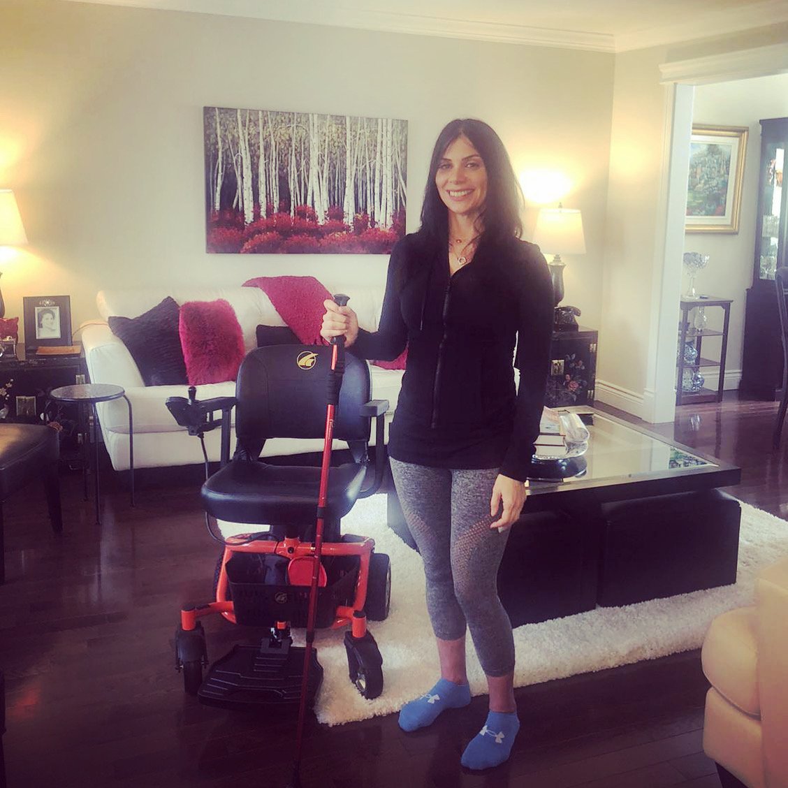 Anna with a Cane Next to her Golden LiteRider Envy Power Chair