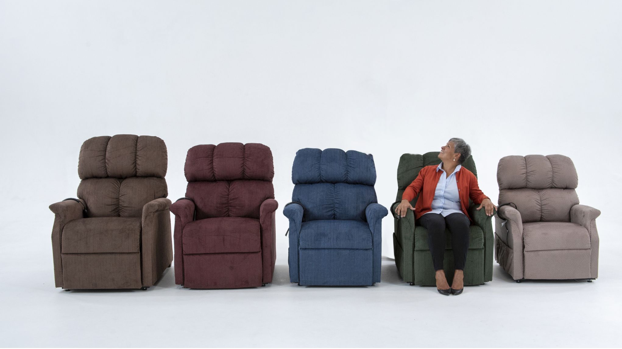 Line of chairs with a woman sitting looking up